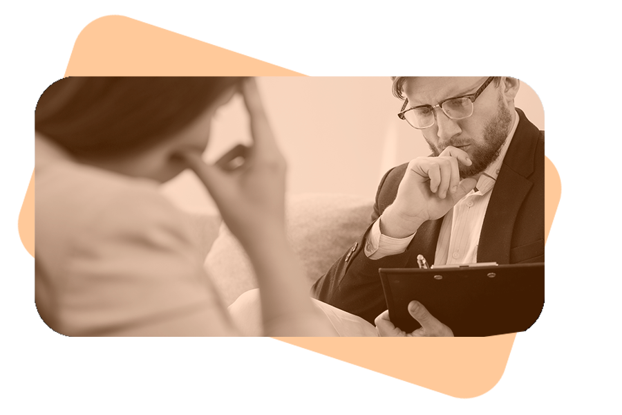 A man wearing glasses and a suit thoughtfully listens to another person while holding a clipboard and pen, suggesting a discussion about a business. An orange rounded edge rectangle frames the image.